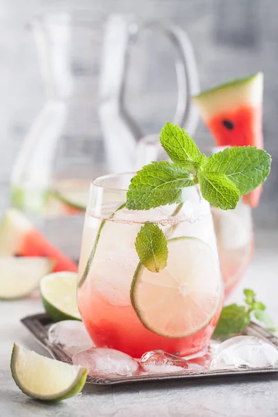 Fresh watermelon lemonade with lime, ice and mint — Stock Photo, Image