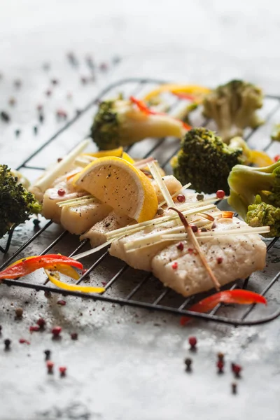 Grilled seabass with lemon, rosemary, red and black papper — Stock Image Grilled seabass with lemon, rosemary, red and black papper Stock Photo