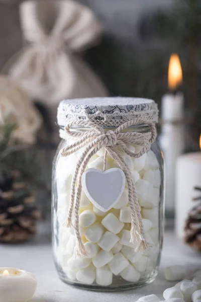 Gift glass jar with marshmallows for Christmas