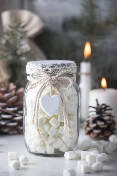 Gift glass jar with marshmallows for Christmas