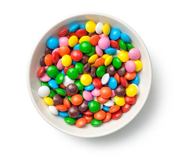 Coloridas píldoras de caramelo de chocolate en el tazón aislado en Backgro blanco —  Fotos de Stock