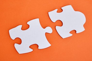 A studio photo of jigsaw pieces clipart