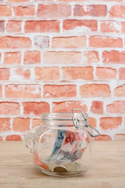 A studio photo of a money jar