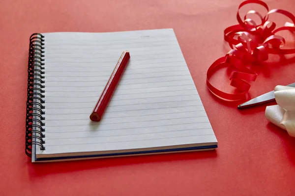 A studio photo of a blank note pad