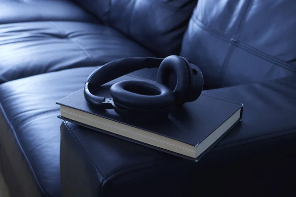 A studio photo of black headphones