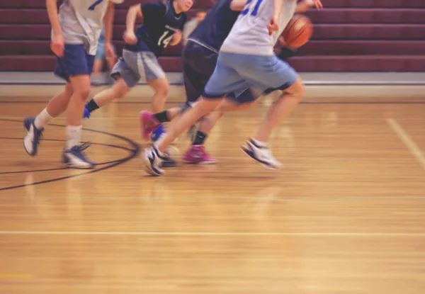 A girls basketball team running up or down the court — Stock Photo, Image