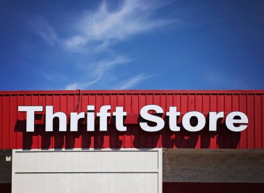 thrift store front sign in the summer time clipart