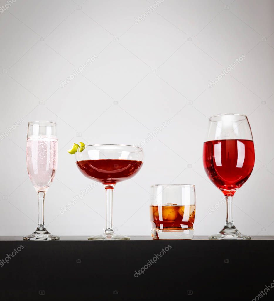 line of cocktails on a bar