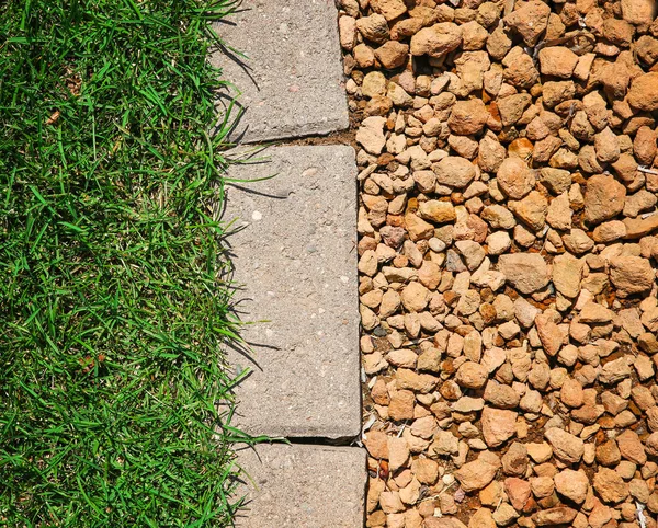 Grass bricks and stone landscaping in a nice manicured yard good — Stock Photo, Image