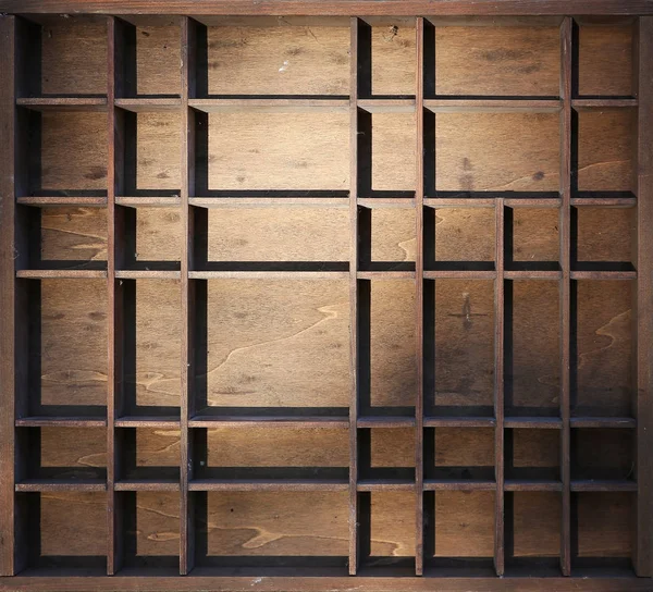 A miniature wooden shelf with dust and cobwebs in dramatic light — Stock Photo, Image