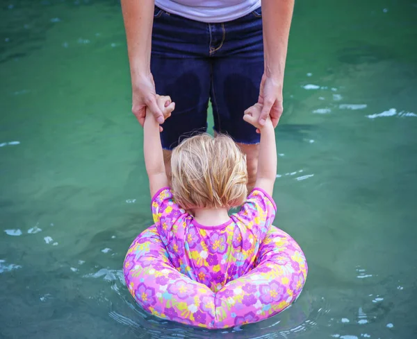 Mother Holding Hands Her Child Water Personal Flotation Device Toned — Stock Photo, Image