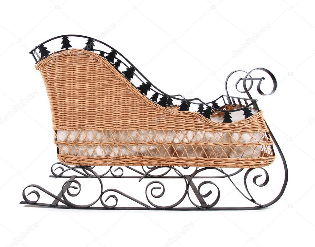 christmas sleigh made of wicker and metal isolated on white background  