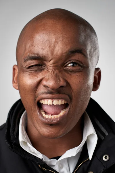 African man making silly expression — Stock Photo, Image