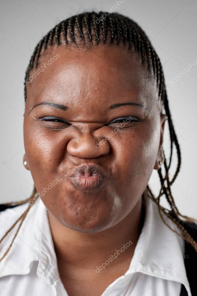 Funny black African woman face Stock Photo by ©Daxiao_Productions 129284464