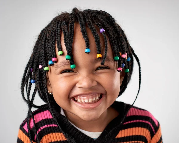 Adorable little girl with african pigtails — Stock Photo, Image