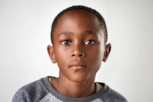 Little African boy with no expression — Stock Photo, Image