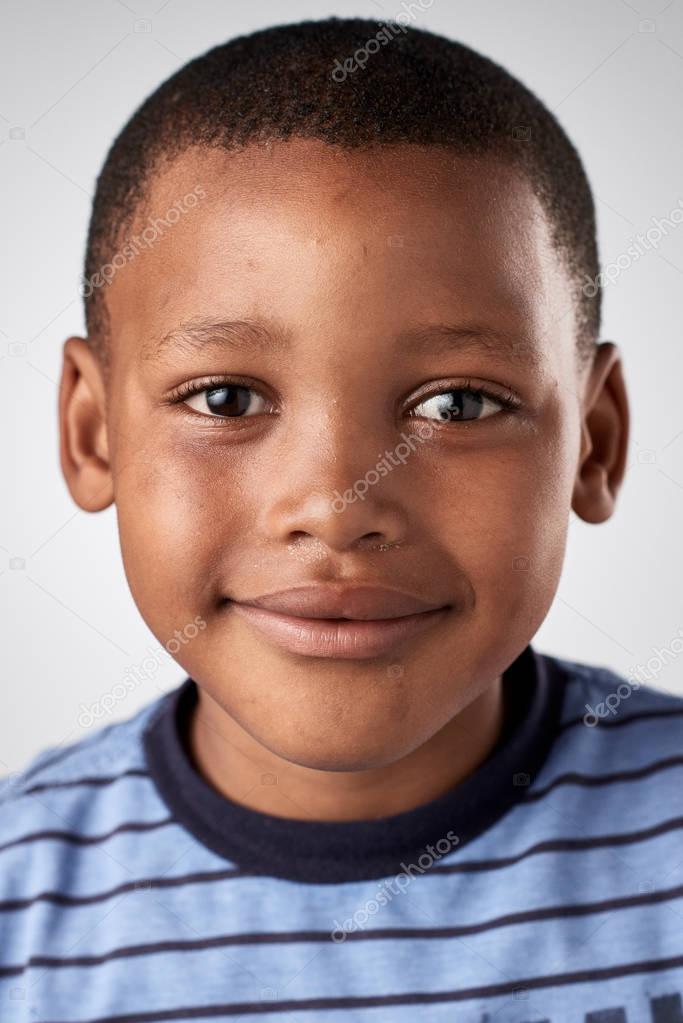 Happy African boy Stock Photo by ©Daxiao_Productions 129314136