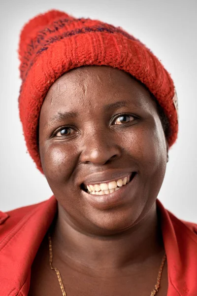 African woman in red hat — Stock Photo, Image