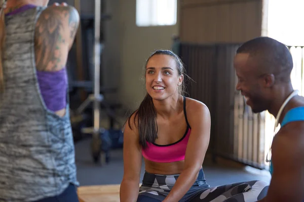 sportive people talking in gym