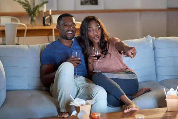 African couple watching movie — Stock Photo, Image