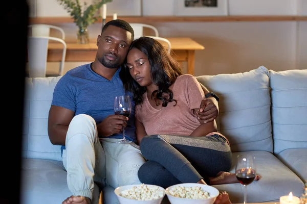 African couple watching movie — Stock Photo, Image