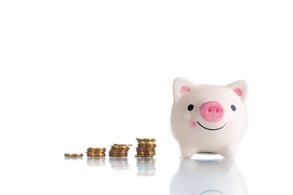 White piggy bank with increasing stack gold coin money — Stock Photo, Image