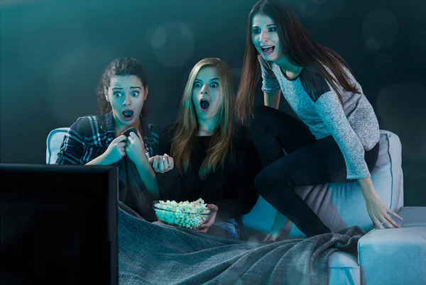 Scared teenage girls watching movie — Stock Photo, Image