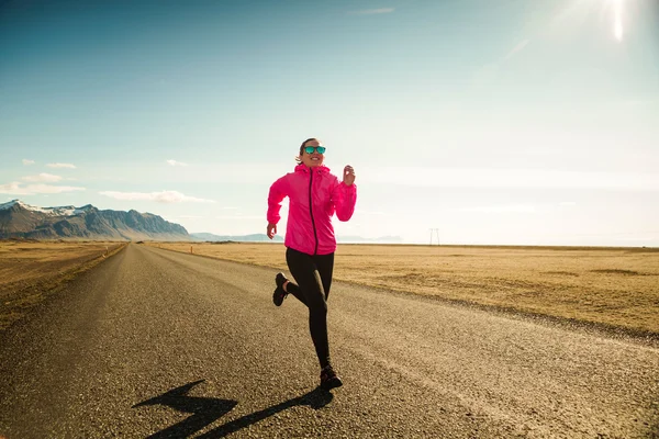 Woman running on road — Stock Photo, Image