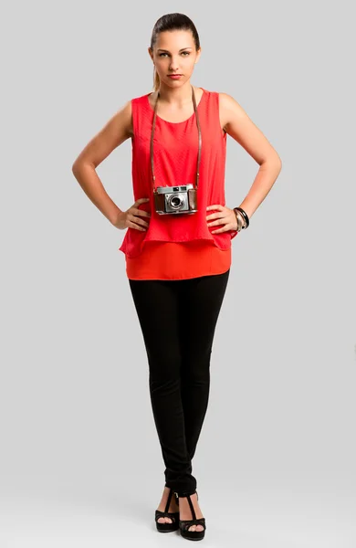 Pretty woman posing in red blouse — Stock Photo, Image