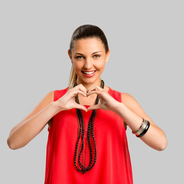 Pretty woman posing in red blouse — Stock Photo, Image