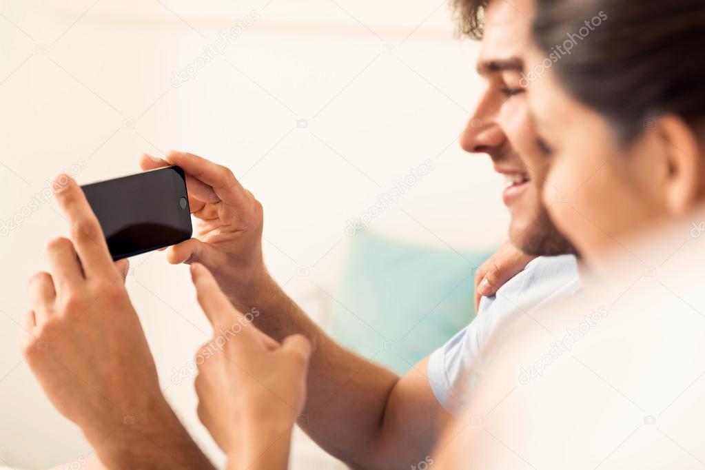couple watching videos on cellphone
