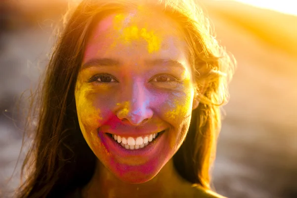 Portrait of girl full of colored powder — Stock Photo, Image