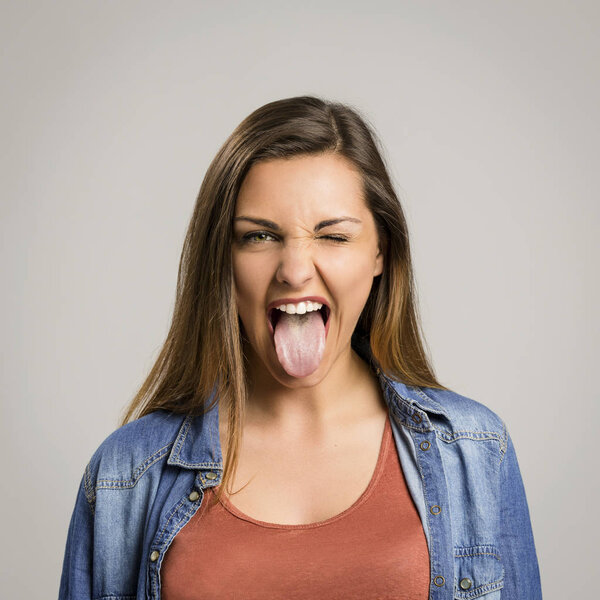 Woman showing tongue out