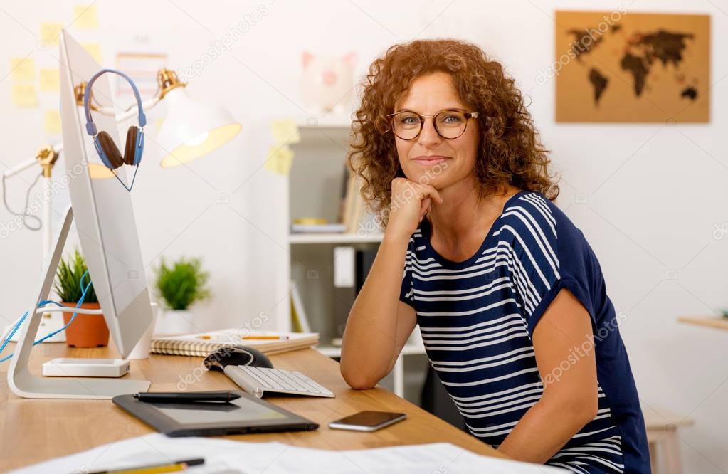woman at office working with laptop