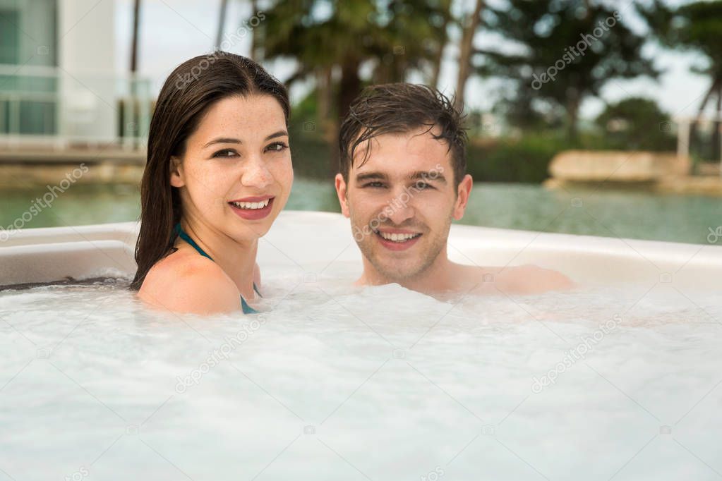 Young couple in jacuzzi