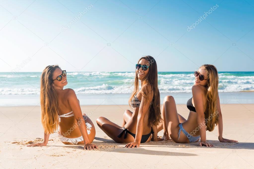 girls on beach looking back