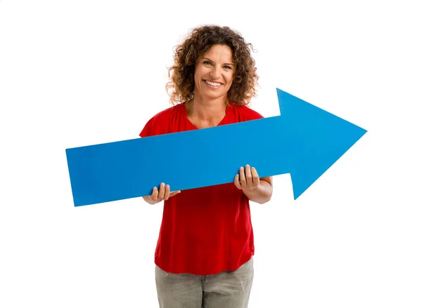 Woman holding blue arrow — Stock Photo, Image