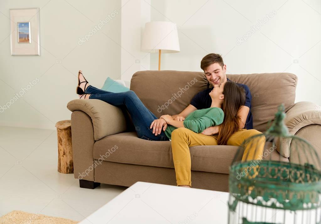 Couple sitting on sofa 