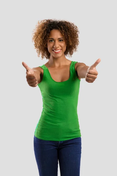 Vertrouwen vrouw met een duim omhoog — Stockfoto