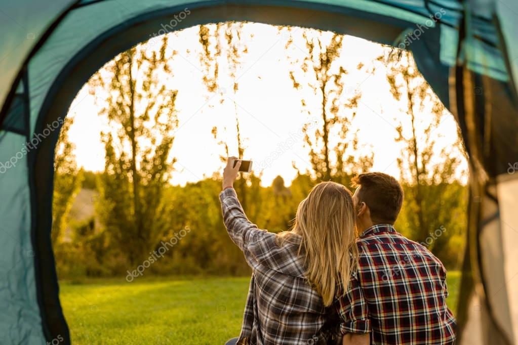 happy couple camping