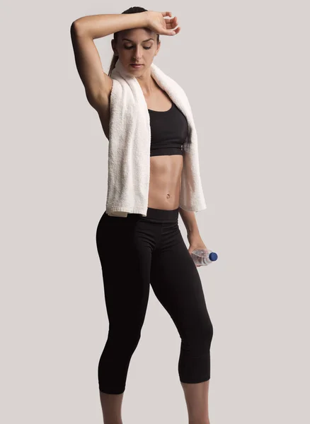 Woman tired after a gym workout — Stock Photo, Image