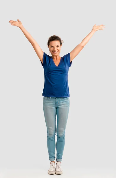 Middle aged brunette with arms up — Stock Photo, Image