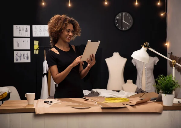 Designer working with tablet on atelier — Stock Photo, Image