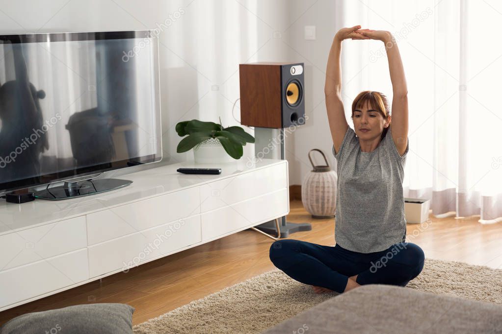 woman doing yoga exercise at home
