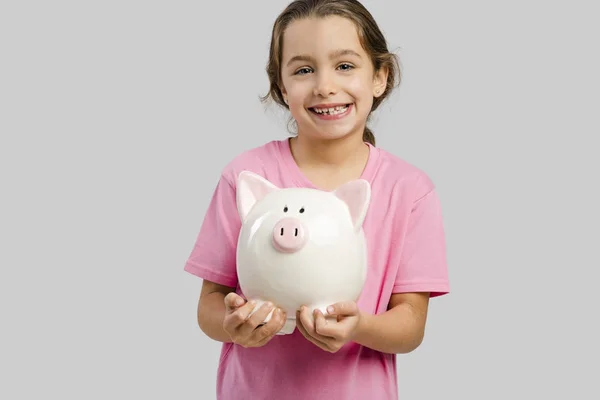 Meisje bedrijf piggy bank — Stockfoto
