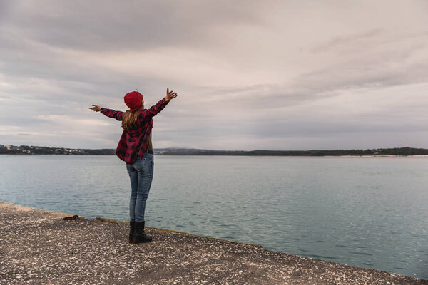 young woman near lake