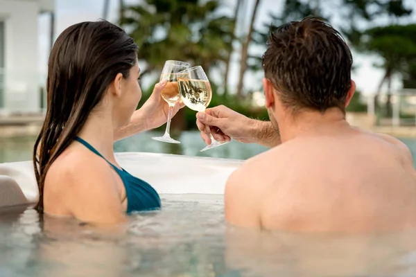 Young Couple Relaxing Jacuzzi Toasting — Stock Photo, Image