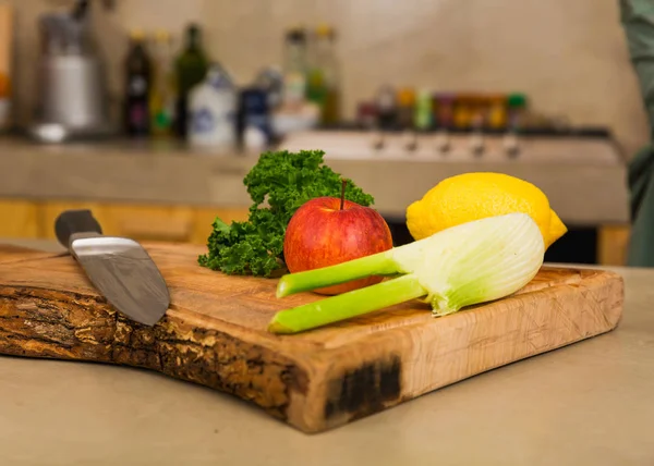 Detail view of ingredients for detox juice on wooden board.