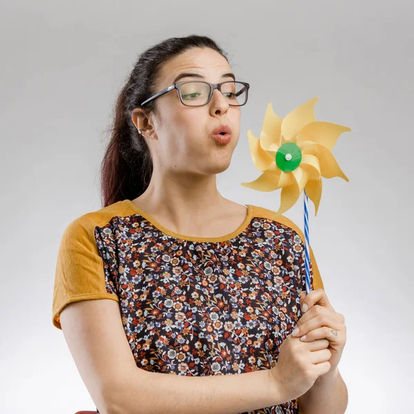 Blowing a windmill — Stock Photo, Image