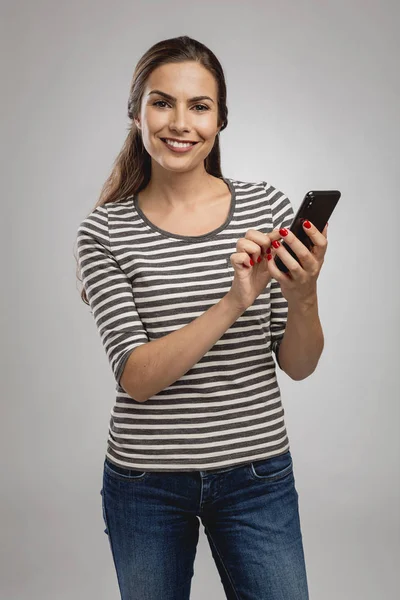 Happy Young Woman Sending Text Message — Stock Photo, Image